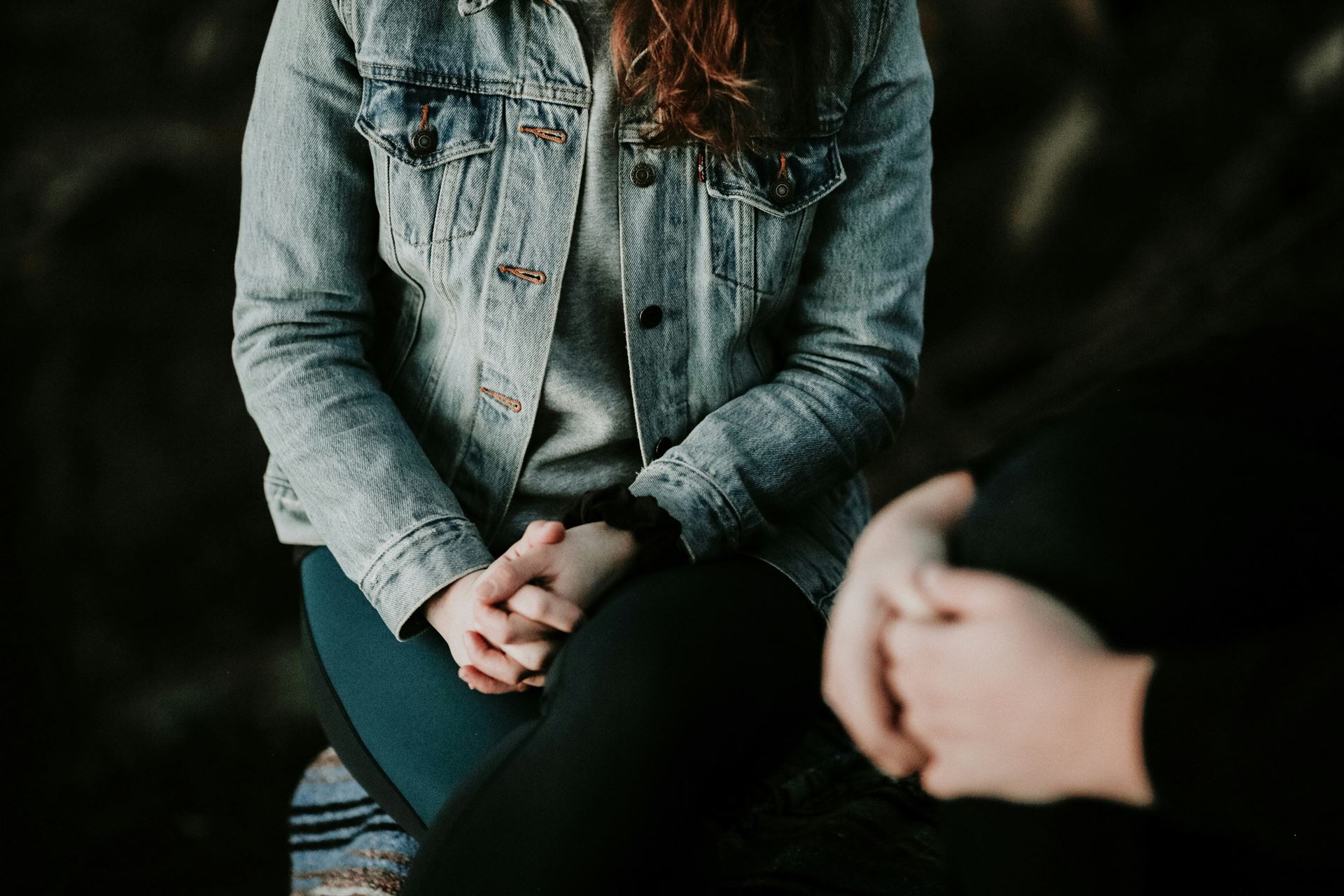 photo of woman with hands clasped